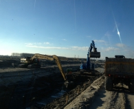 Cat 325 lange giek uitgerust met GPS